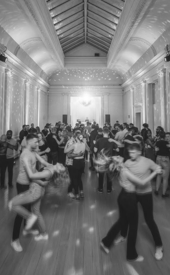 The wooden dancefloor at Keystone Crescent, with lights and a mirror along the wall